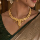 alt="curved petal floral temple necklace gold plated"