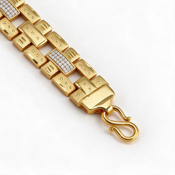 alt="lion head studded gold bracelet"