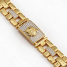 alt="lion head studded gold bracelet"