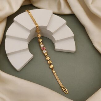 alt="triple heart studded gold bracelet"