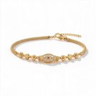 alt="floral medallion gold bracelet"