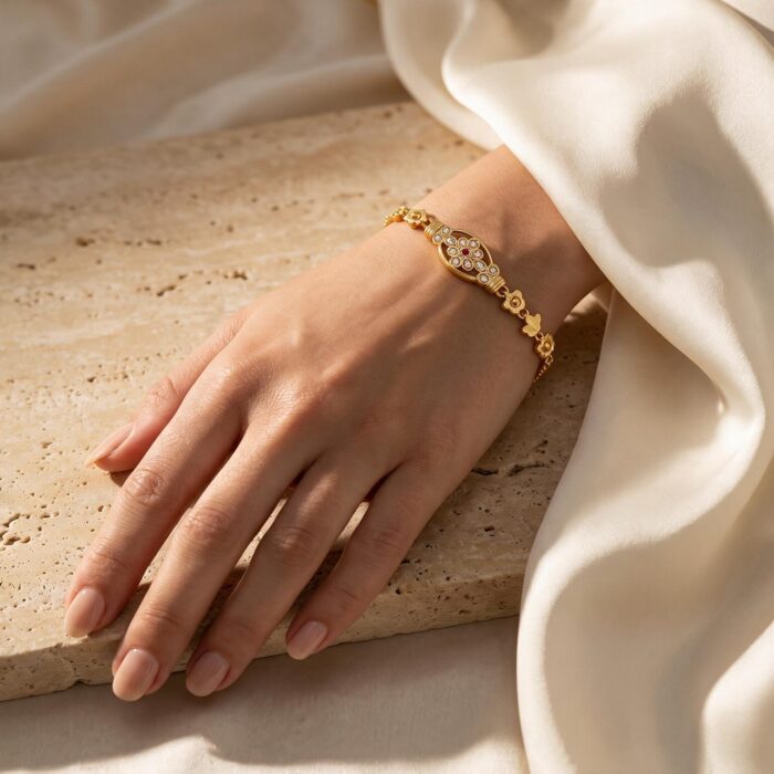 alt="floral medallion gold bracelet"