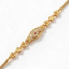 alt="floral medallion gold bracelet"