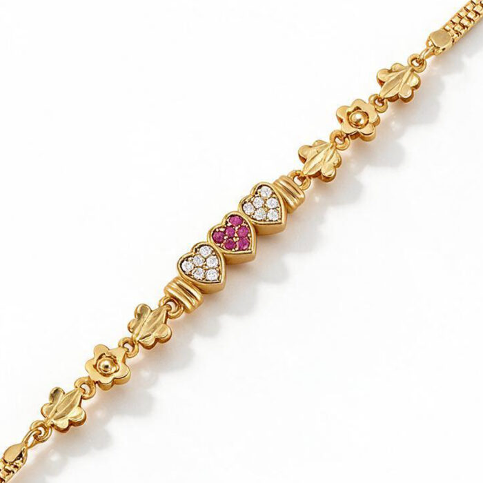 alt="triple heart studded gold bracelet"